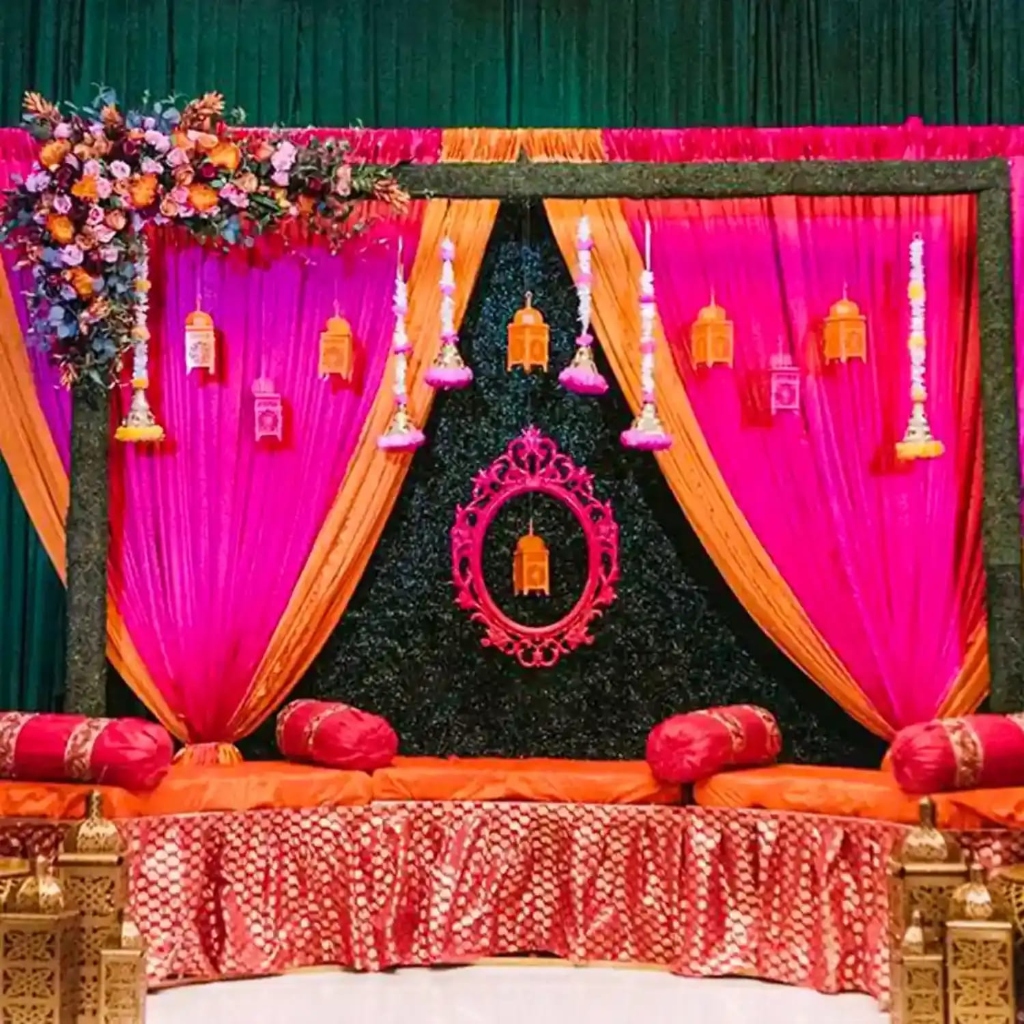 Traditional Ganesha Floral Stage with Pink & Yellow Drapes