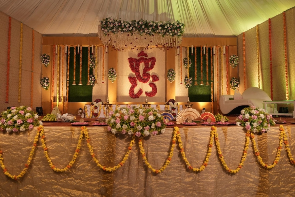Traditional Floral Mandap with Red Ganesha Backdrop
